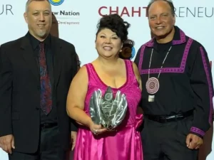 Steve Johnson and Sash Johnson of Choctaw Websites receiving the Business of the Year Award with Choctaw Chief Gary Batton